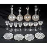 *Glassware. A part suite of Edwardian glass, comprising a pair of globe and spire decanters, plus