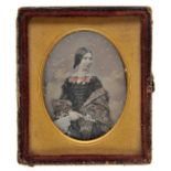 *Kilburn (William Edward, 19th century). A ninth-plate daguerreotype of a young lady, circa 1855,