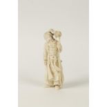 A JAPANESE ONE PIECE CARVED ELEPHANT IVORY FIGURAL OKIMONO "The Falconer", well detailed, an empty