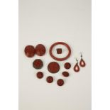 A GROUP OF CHINESE CINNABAR LACQUER ITEMS OF JEWELLERY comprising floral belt buckle, two