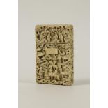 A CHINESE EXPORT CARVED IVORY CALLING CARD CASE worked with numerous figures in pavilion settings,