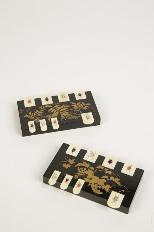 A PAIR OF JAPANESE SHIBAYAMA INLAID IVORY OR BLACK LACQUER BEZIQUE MARKERS, in original protective