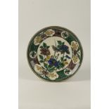 A JAPANESE KUTANI SHALLOW DISH centrally painted with a song bird in a peony bush, pseudo seal mark,