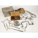 A COLLECTION OF MILITARY DOCTOR'S EQUIPMENT including field medical tools and other items.