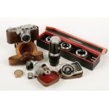 A LEICA D.R.P. CAMERA, no. 362366, in a leather case with accessories and other related items. The