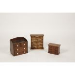 A MINIATURE VICTORIAN CHEST OF TWO SHORT AND TWO LONG DRAWERS with raised back and small ceramic