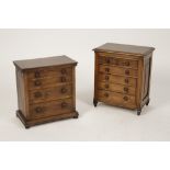 A VICTORIAN STYLE MINIATURE CHEST OF DRAWERS with rectangular top above four graduated drawers