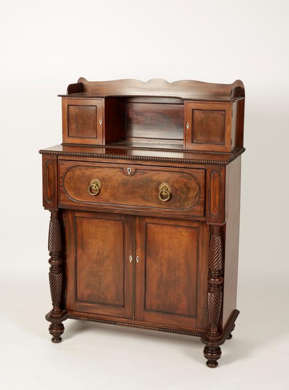 A REGENCY MAHOGANY SECRETAIRE CHIFFONIER, the upper section with a shaped frieze above a central