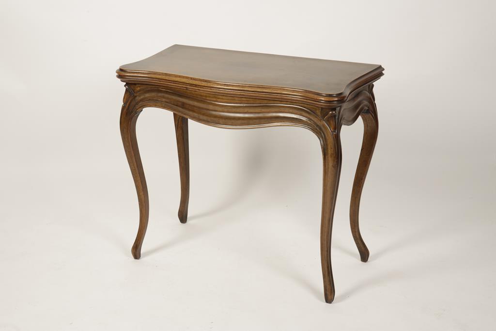 A FRENCH WALNUT CARD TABLE, the serpentine bordered top enclosing a baize-lined playing surface