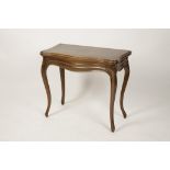 A FRENCH WALNUT CARD TABLE, the serpentine bordered top enclosing a baize-lined playing surface