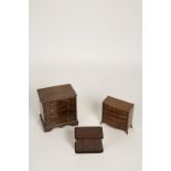 A VICTORIAN MAHOGANY MONEY BOX in the form of a Victorian chest, the front modelled as two short and