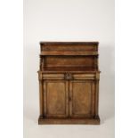 A REGENCY MAHOGANY CHIFFONIER, the raised back with two shelves on scrolling brackets, the
