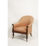 A REGENCY MAHOGANY FRAMED ARMCHAIR with a swept upholstered back with foliate carved scrolling arm