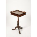 IN THE MANNER OF GILLOWS: A REGENCY ROSEWOOD WORK TABLE, the rectangular top with carved scrolling