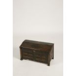 A CONTINENTAL PAINTED MINIATURE BUREAU STYLE CHEST with a sloped rising lid decorated with a painted