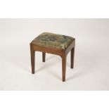 A GEORGE III MAHOGANY STOOL, the rectangular tapestry upholstered drop-in seat on a straight-sided