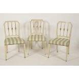 A SET OF EIGHT SHERATON STYLE DINING CHAIRS with all over cream painted and green lined frames, with