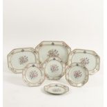 A CHINESE EXPORT PART FAMILLE ROSE ARMORIAL PORCELAIN DINNER SERVICE