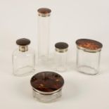 A TORTOISESHELL AND SILVER MOUNTED PART DRESSING TABLE SET