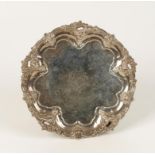 A VICTORIAN SALVER of shaped circular form