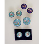 A PAIR OF PAINTED PORCELAIN BUTTONS