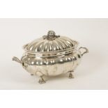 A CONTINENTAL WHITE METAL TUREEN AND COVER