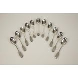 A HARLEQUIN SET OF ELEVEN FIDDLE PATTERN DESSERT SPOONS,