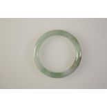 A CHINESE JADE BANGLE of plain circular form