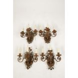 A SET OF FOUR CONTINENTAL PAINTED THREE BRANCH WALL SCONCES