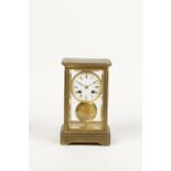 A BRASS "FOUR GLASS" MANTEL CLOCK