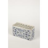 A DELFTWARE TIN GLAZED FLOWER BRICK