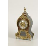 A FRENCH BOULLE WORK AND EBONY MANTEL CLOCK