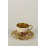 A ROYAL WORCESTER PORCELAIN CABINET CUP AND SAUCER