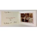 TRH THE PRINCE AND PRINCESS OF WALES: SIGNED CHRISTMAS CARD, with twin gilt embossed ciphers to