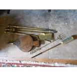 A SET OF THREE BRASS LONG HANDLED FIRE IRONS, a poker, tongs, shovel and a pair of oak bellows (4)