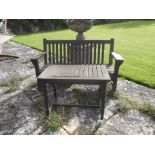 A WOODEN GARDEN BENCH of traditional slatted design, 60.5" wide and a similar garden table, 32.5"