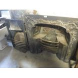 A VICTORIAN CAST IRON FIREPLACE with rococo style cast decoration, 34.5" x 34", and another