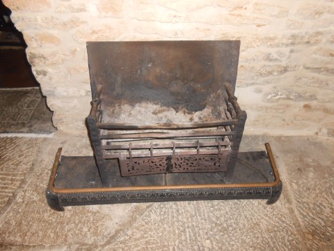 AN IRON FIRE BASKET and similar fire curb, the curb 38" long