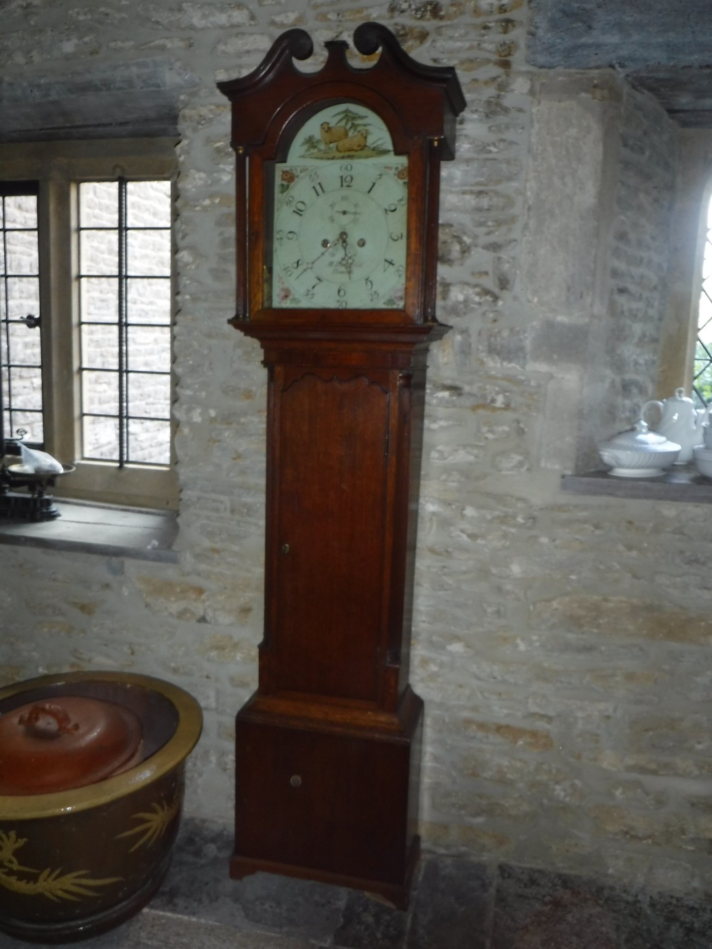 A GEORGE III OAK LONGCASE CLOCK, the white enamel dial with Arabic numerals and subsidiary seconds