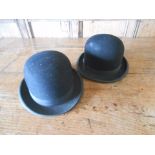 A BLACK BOWLER HAT by Evans May Ray & Co., and another similar by Tress & Co. (2)