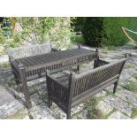 A MODERN WOODEN GARDEN TABLE of slatted design with corner finials and similar slatted frieze, 72.5"