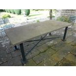 A CONTEMPORARY GARDEN TABLE with a broad rectangular stone top with visible seashell fossils, on a