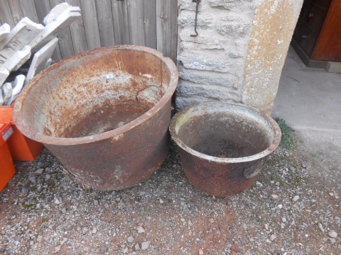 A LARGE IRON "COPPER" and another similar smaller, 29.25" and 20.5" wide (2)