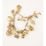 A YELLOW GOLD CHARM BRACELET