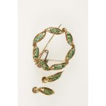 AN "EMERALD" BROOCH