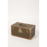 LOUIS VUITTON: A LEATHER COVERED TRAVELLING JEWELLERY OR MAKE-UP CASE
