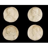 A SET OF FOUR CARVED MARBLE ROUNDELS