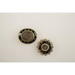A WILLIAM IV BLACK ENAMEL AND PEARL MOURNING BROOCH