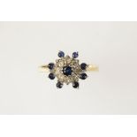 A SAPPHIRE AND DIAMOND CLUSTER RING