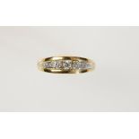 A THREE STONE DIAMOND DRESS RING